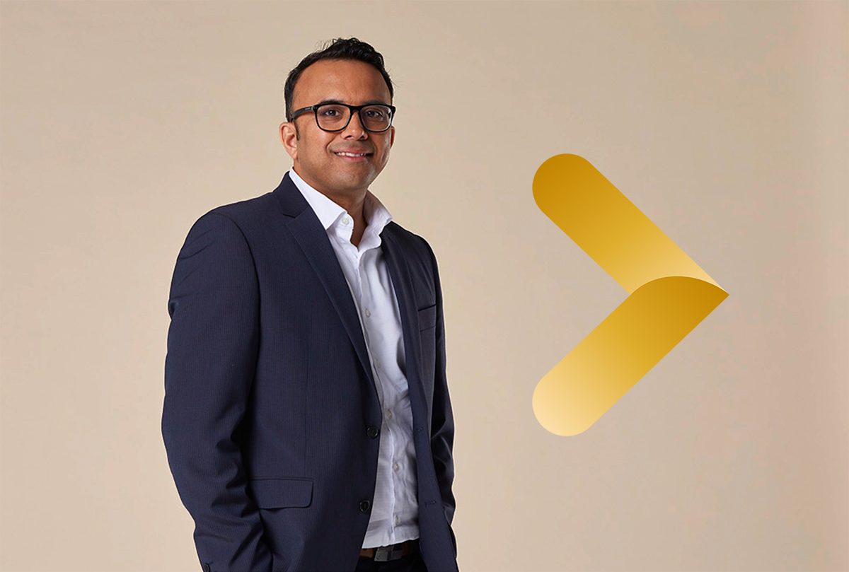 Man in suit on plain background with brand arrow