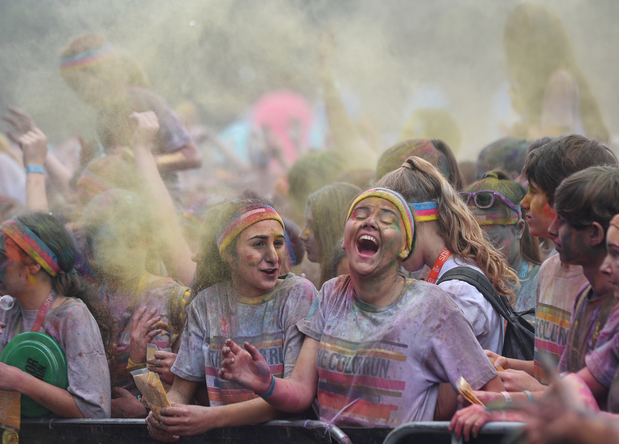 Young girls in crowd at Colour Run celebration