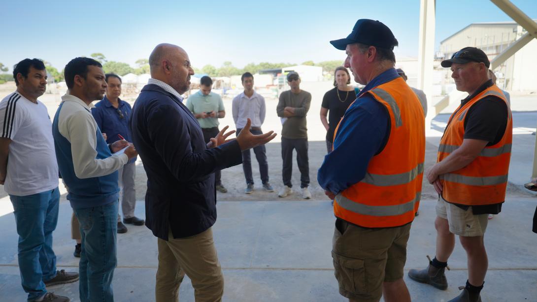 Professor Harpinder Sandhu discussing with a group of farmers