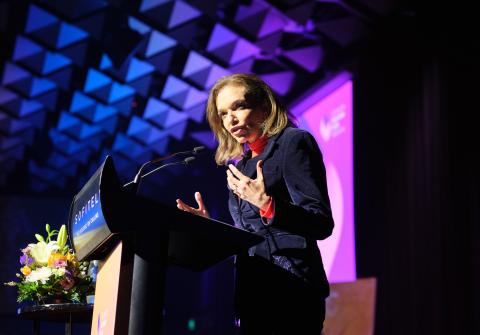 Speaker at podium giving talk at Maitri Showcase 2025